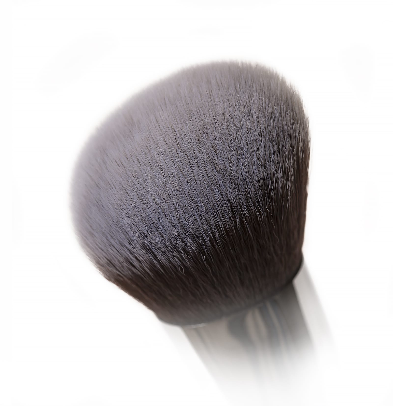 Close-up of the Blush & Bronze brush from Nanshy, featuring soft, lush bristles perfect for achieving highly contoured cheekbones and a flawless finish.