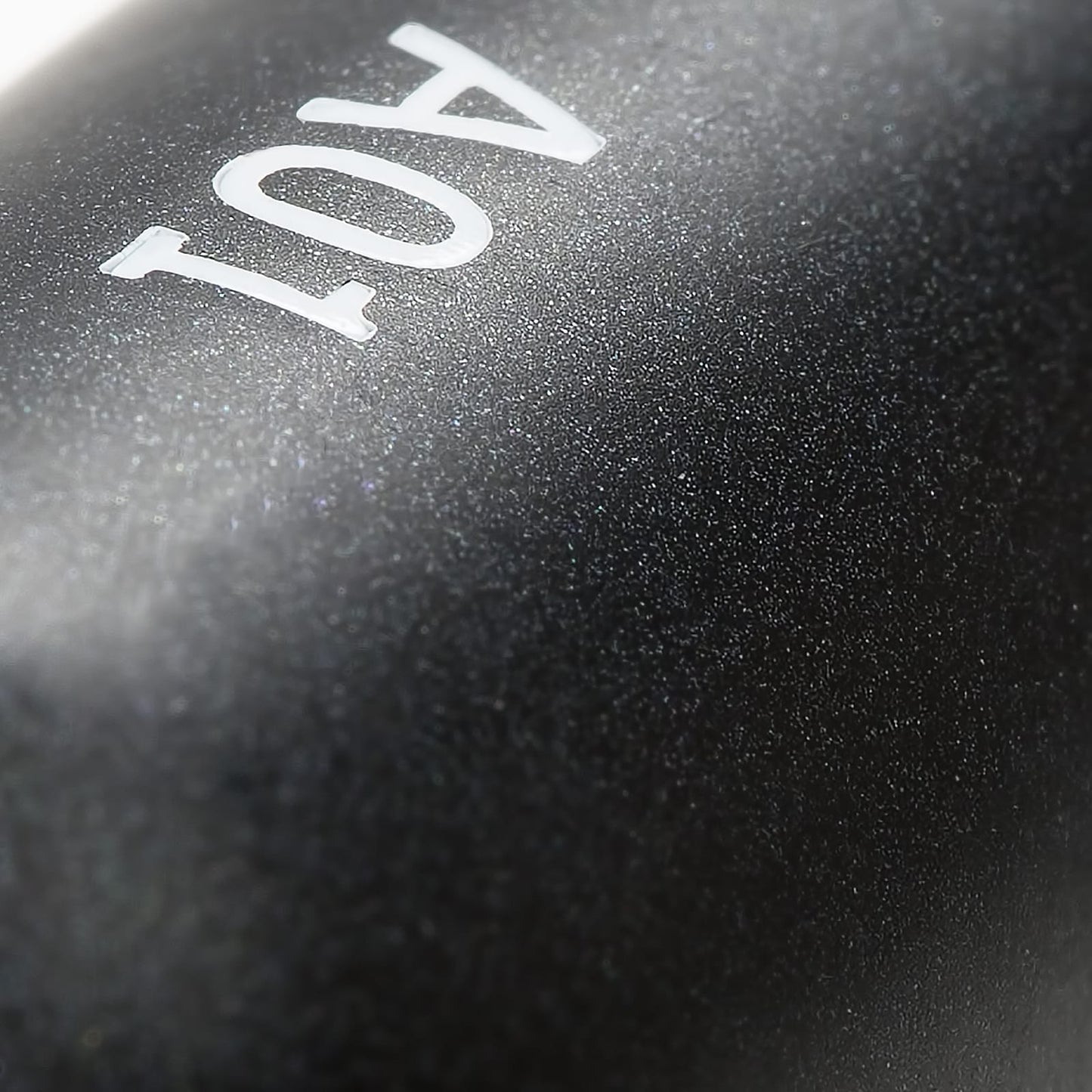 Close-up view of the ergonomic handle of the Buffed Base makeup brush from the Nanshy Collection, showcasing the sleek black design and robust craftsmanship.