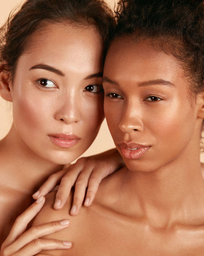 Two models showcasing flawless makeup, highlighting the results achievable with the Flawless Complexion Kit Pink from Shopify.