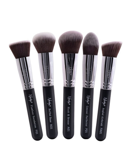 Set of five Nanshy Gobsmack Glamorous makeup brushes with black ergonomic handles and lush, anti-bacterial bristles, displayed upright.