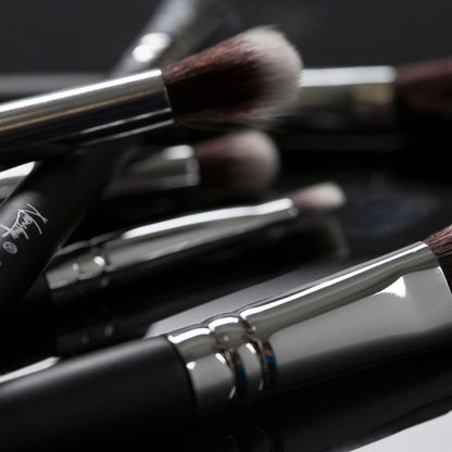 Close-up of Masterful Collection makeup brushes with soft, dense bristles and sleek black handles, perfect for all your beauty needs.