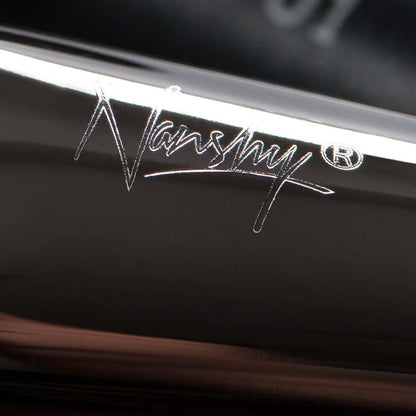 Close-up view of the Nanshy logo etched on the handle of a makeup brush from the Masterful Collection.