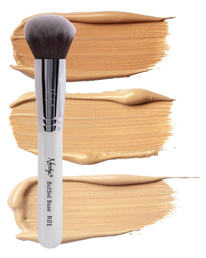 Nanshy Buffed Base makeup brush with soft bristles, perfect for applying and blending foundation, shown with creamy, streak-free foundation swatches.